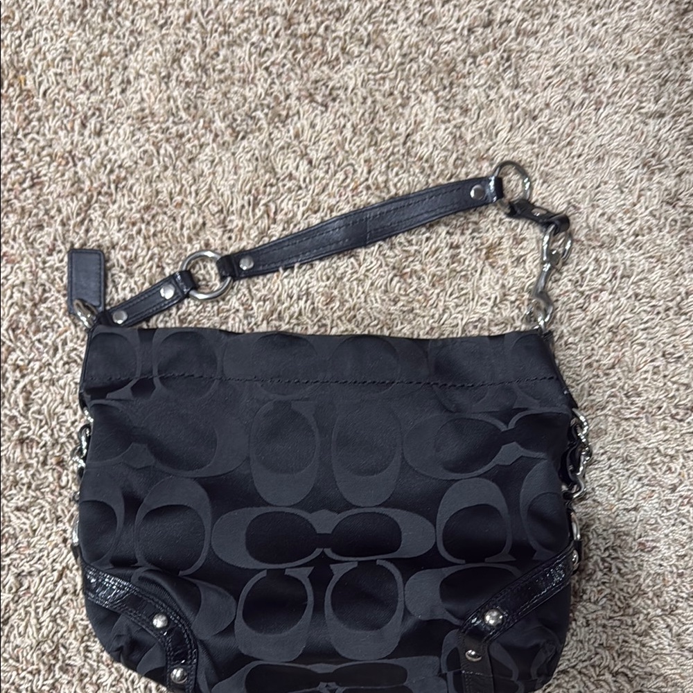 Black Crossbody Bag with Adjustable Strap and Monogram Pattern